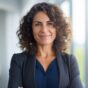 a confident Latin middle-aged businesswoman stands in her office with her arms crossed, looking directly at the camera for a portrait a confident Latin middle-aged businesswoman stands in her office with her arms crossed, looking directly at the camera for a portrait